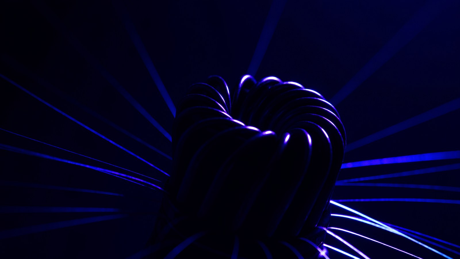 A coiled spiral antenna element with signal traces radiating outward